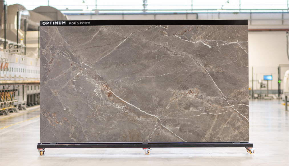 Gray marble effect slab with elegant white veins and brown details